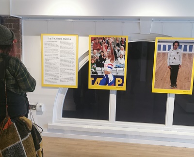 Someone looking at photos and information at the recent Spotlight on Success exhibition at North Herts Museum