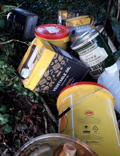 Fly-tipped oil containers