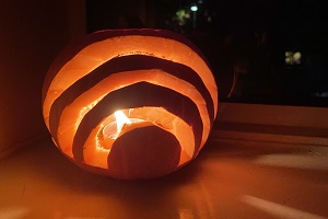 Pumpkin carved with a rainbow decoration