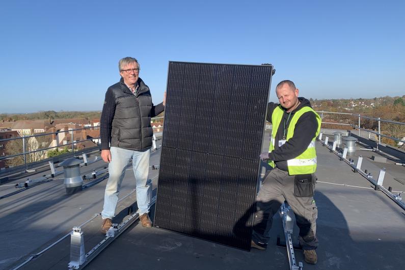 Cllr Steve Jarvis (left) on the roof with a contractor