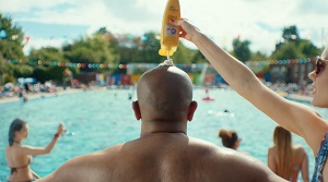 Man with suncream on his head